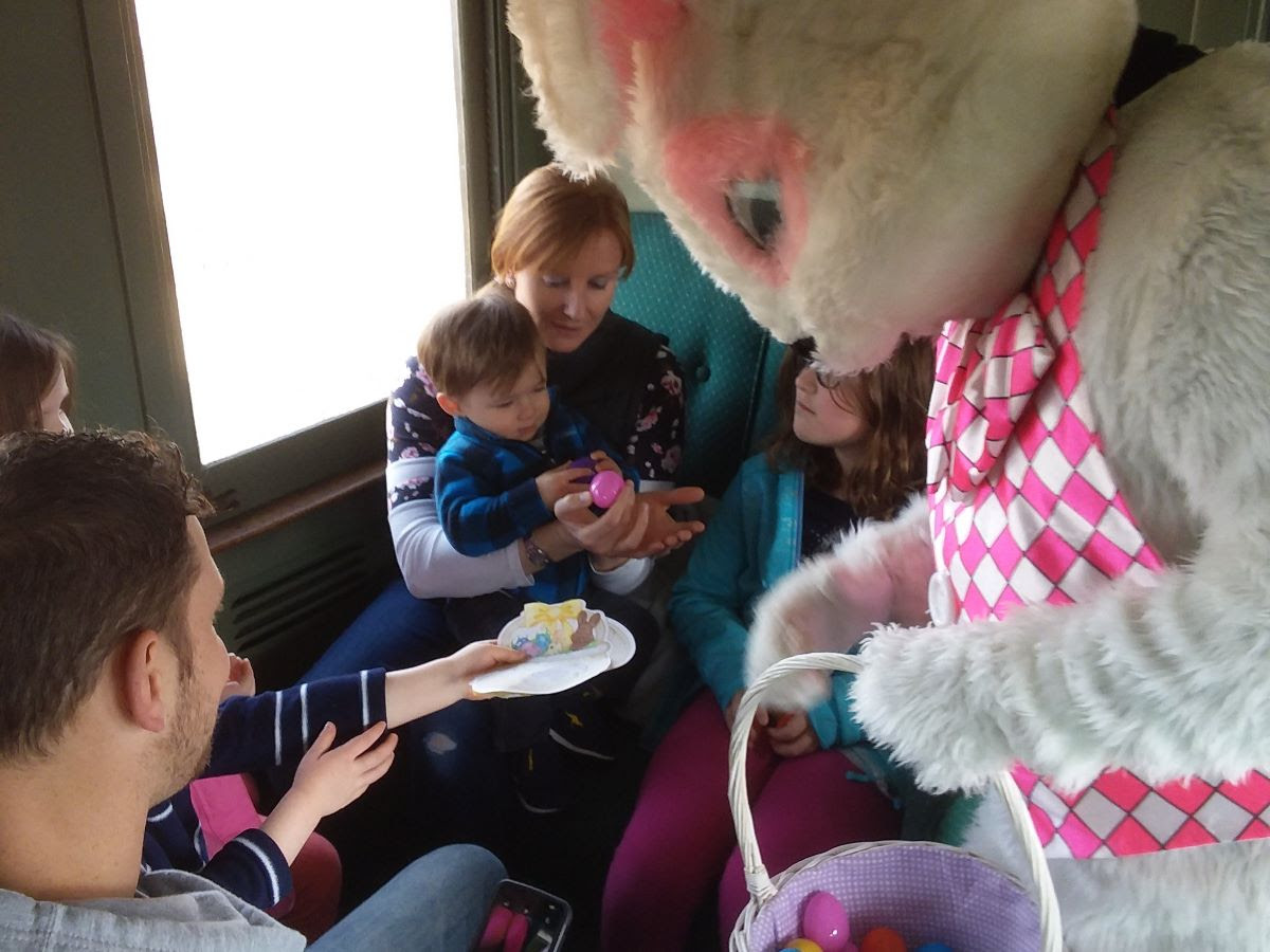 The Easter Bunny passes out eggs to some happy children at last year's open house.